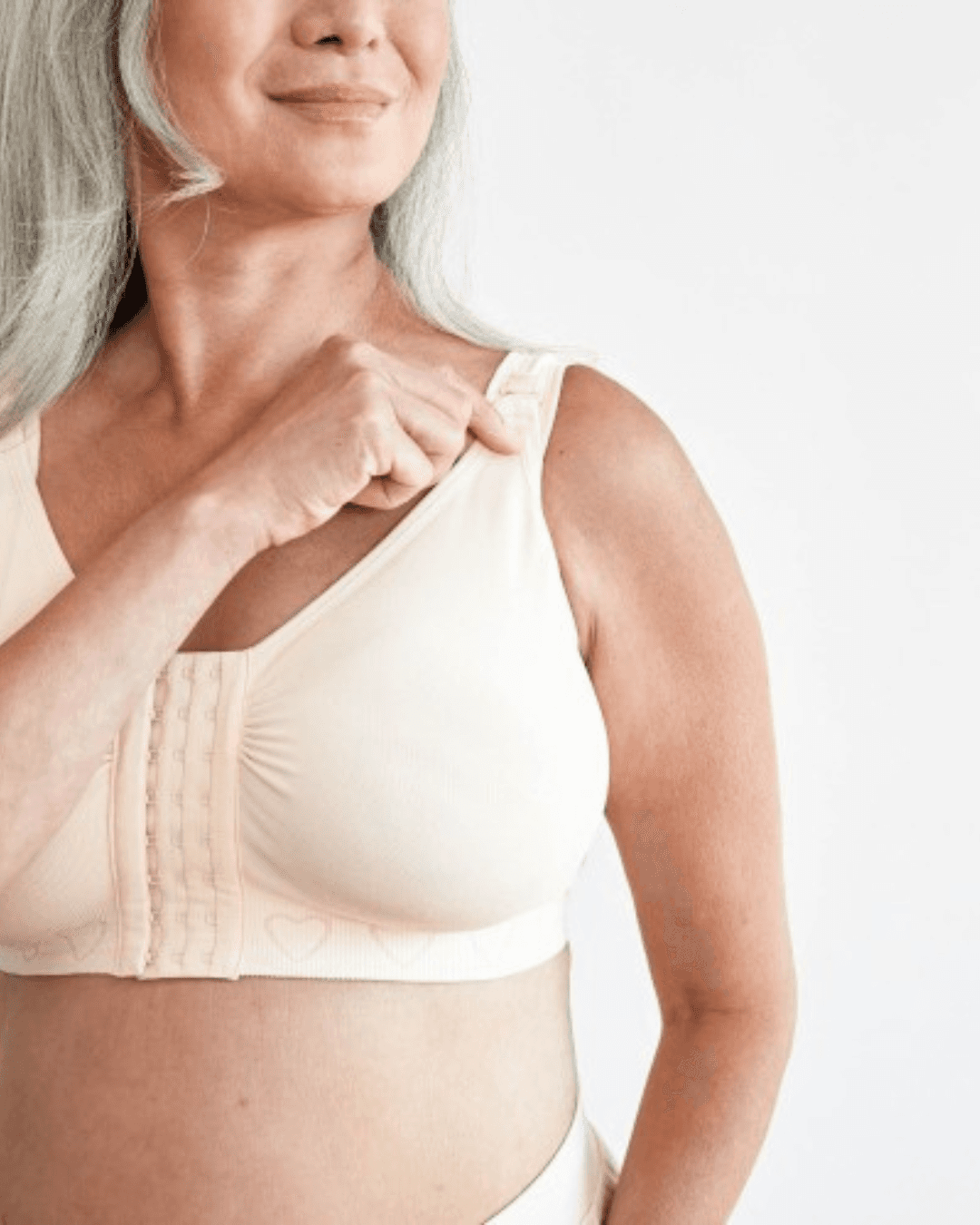 Cancer Research UK Post-Surgery Comfort Bra - Soft bamboo fabric bra designed for breast cancer patients. Offers comfort and support after mastectomy or breast cancer surgery. Available in white, black, and blush. Sizes range from Small to XXL. 100% net profits fund breast cancer research.