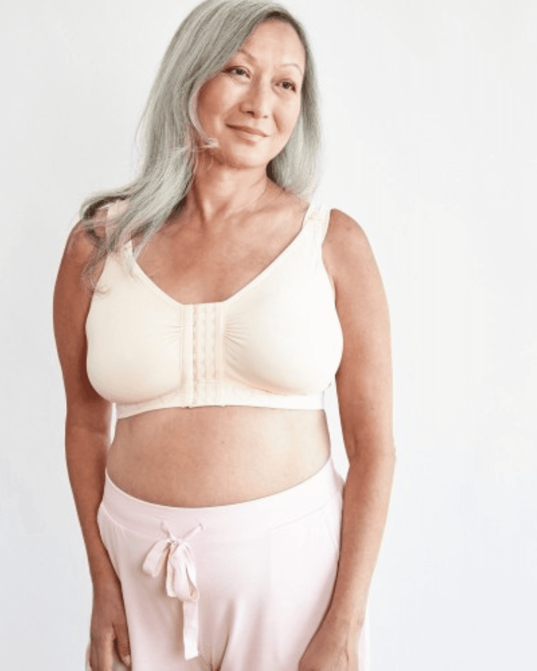 Cancer Research UK Post-Surgery Comfort Bra - Soft bamboo fabric bra designed for breast cancer patients. Offers comfort and support after mastectomy or breast cancer surgery. Available in white, black, and blush. Sizes range from Small to XXL. 100% net profits fund breast cancer research.