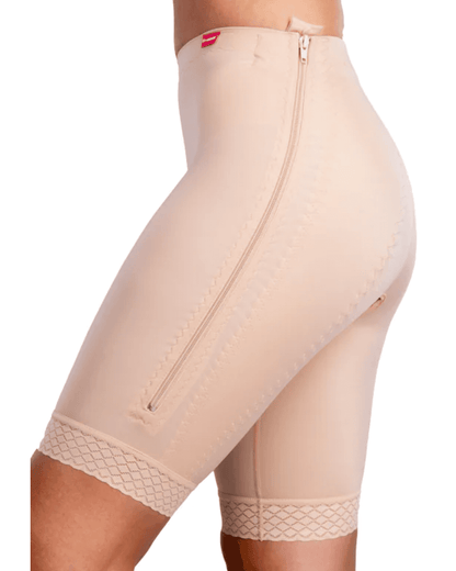 Discover the TF Comfort Garment, ideal for post-operative recovery after liposuction. Suitable for lower tummy, buttocks, pelvic area, hips, and thighs. Offers optimal compression and support. Double-lined fabric reinforces the lower abdomen. Soft lace hem prevents rolling or squeezing. Convenient zipper closures on both sides for easy dressing. Experience comfort and confidence in your recovery journey