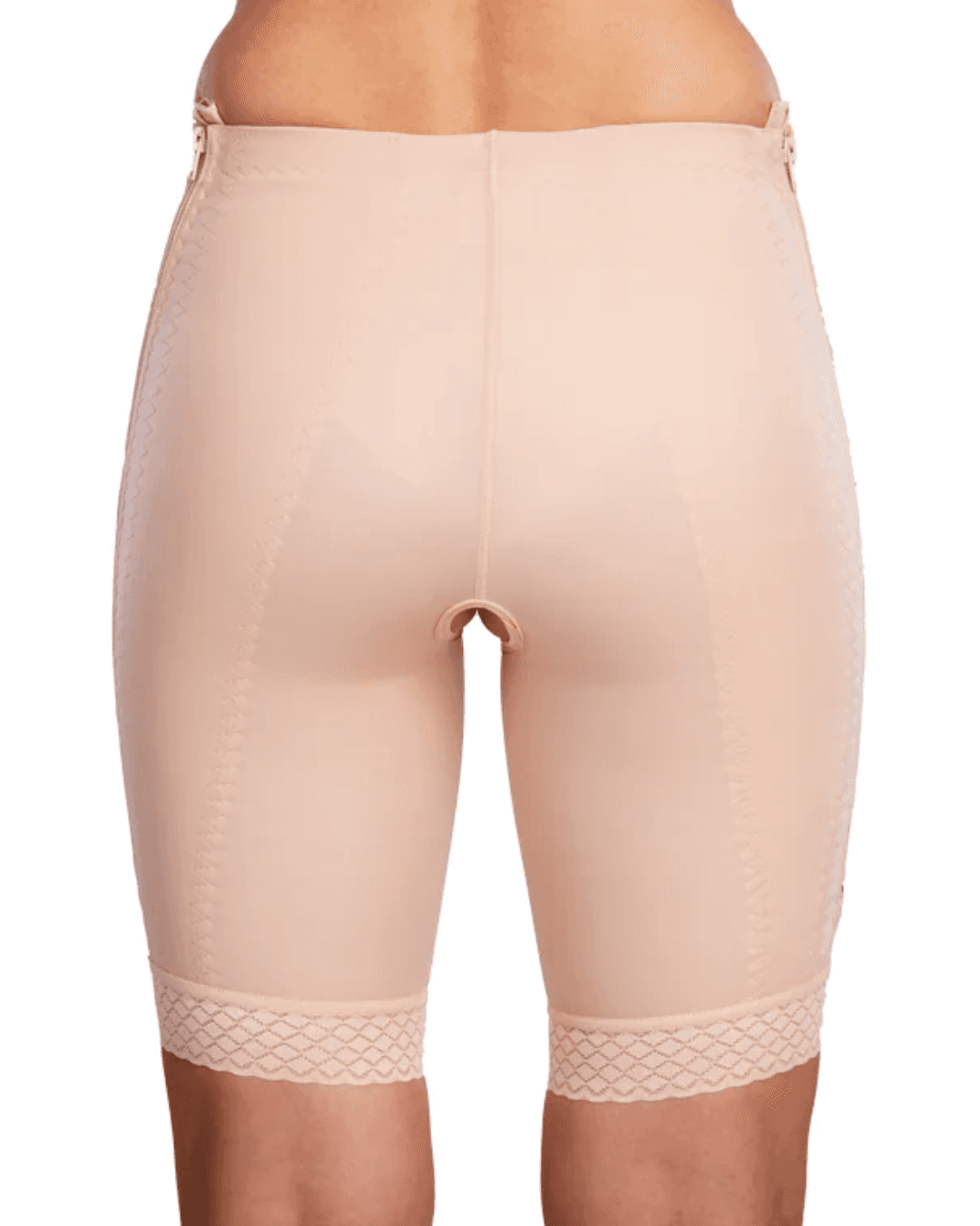 Discover the TF Comfort Garment, ideal for post-operative recovery after liposuction. Suitable for lower tummy, buttocks, pelvic area, hips, and thighs. Offers optimal compression and support. Double-lined fabric reinforces the lower abdomen. Soft lace hem prevents rolling or squeezing. Convenient zipper closures on both sides for easy dressing. Experience comfort and confidence in your recovery journey